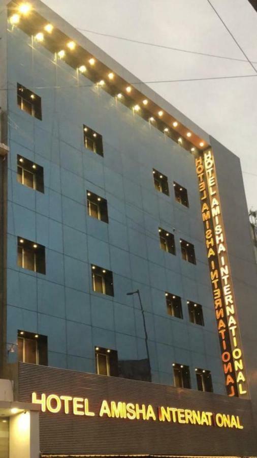 Hotel Amisha International Surat Bagian luar foto